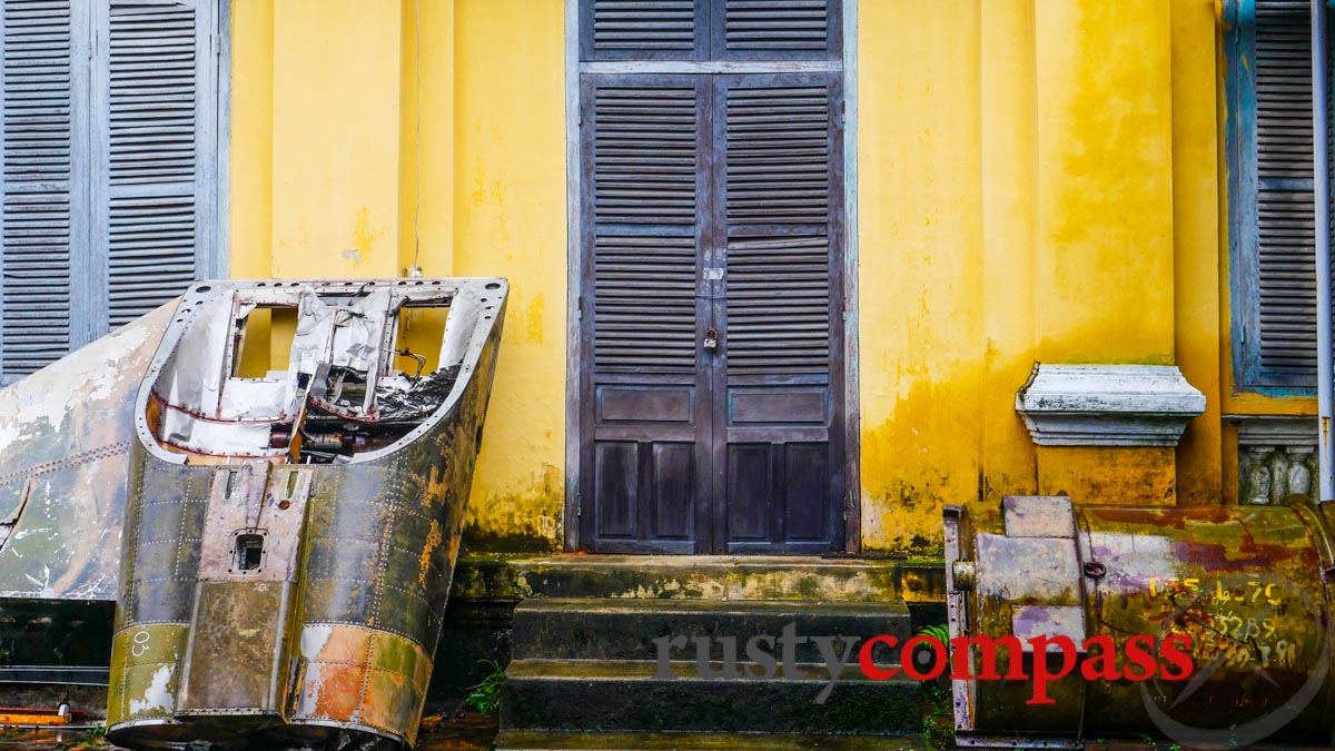 Military junk strewn around the grounds of Hue History Museum Military junk strewn around the grounds of Hue History Museum